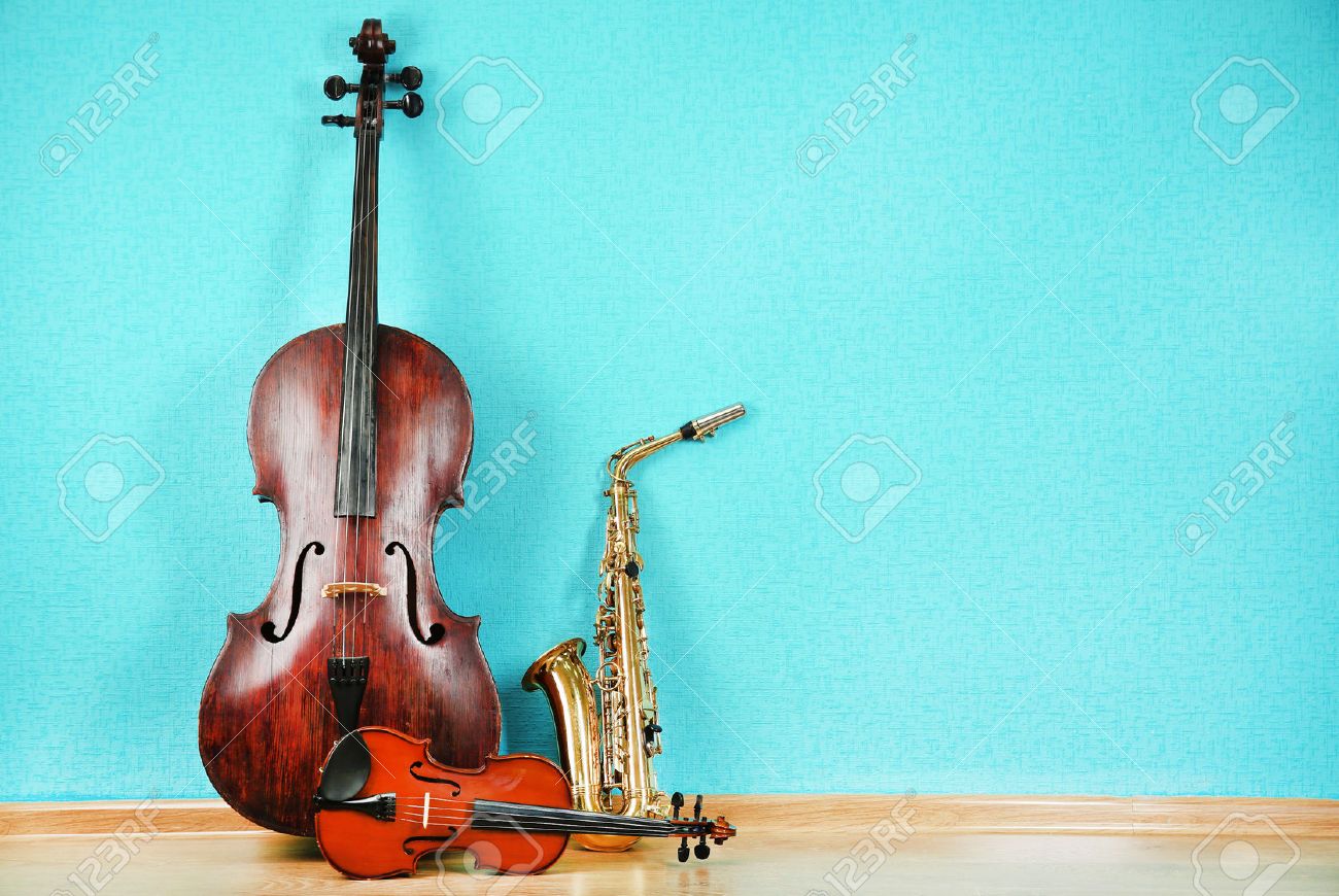 Musical instruments on turquoise wallpaper background - 45177248 Musical instruments on turquoise wallpaper background - 45177248