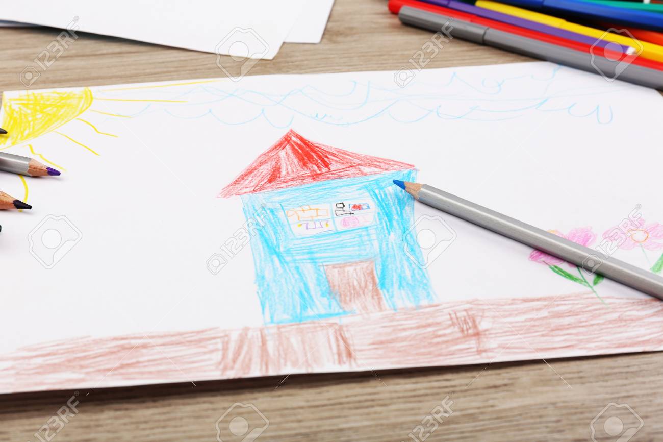 kids drawing on white sheet of paper with crayons and markers