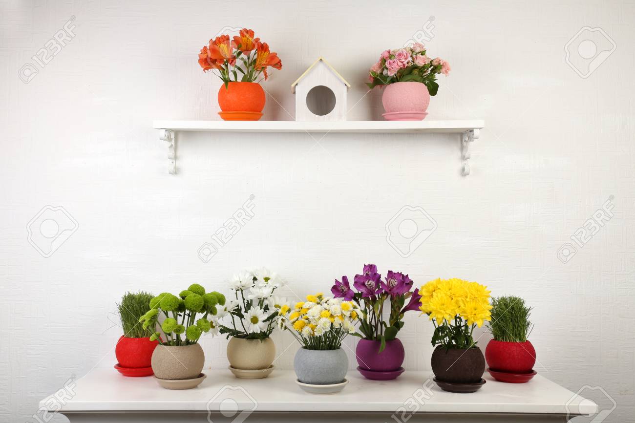 Beautiful Flowers In Pots On Shelf On Wall Background Stock Photo Picture And Royalty Free Image Image 49868818