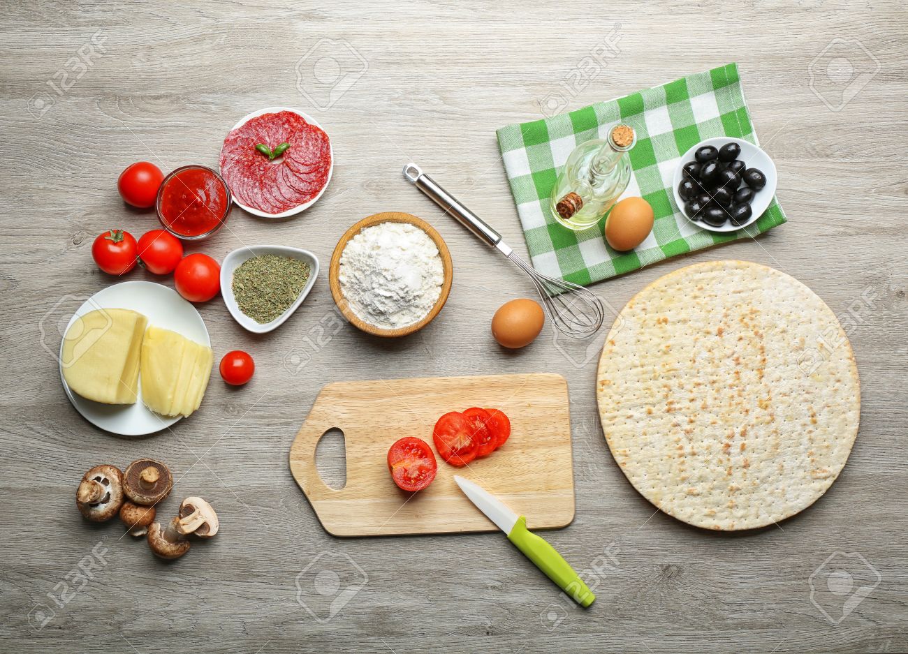 Table Top View ingredients for cooking pizza on wooden table, top view stock Table Top View ingredients for cooking pizza on wooden table, top view stock