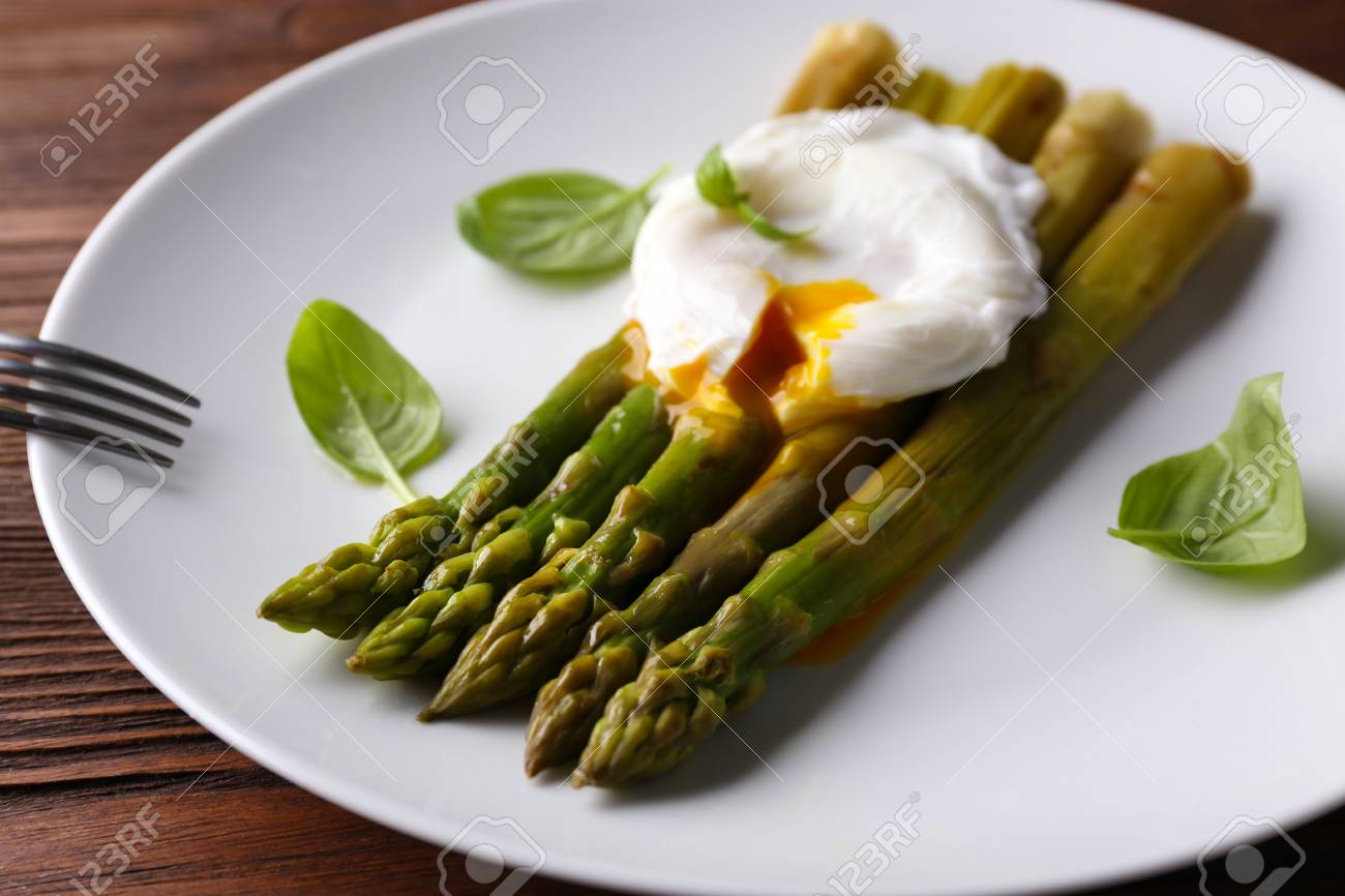 Roasted Asparagus With Poached Egg On Plate On Table Close Up Stock Photo Picture And Royalty Free Image Image 52179068