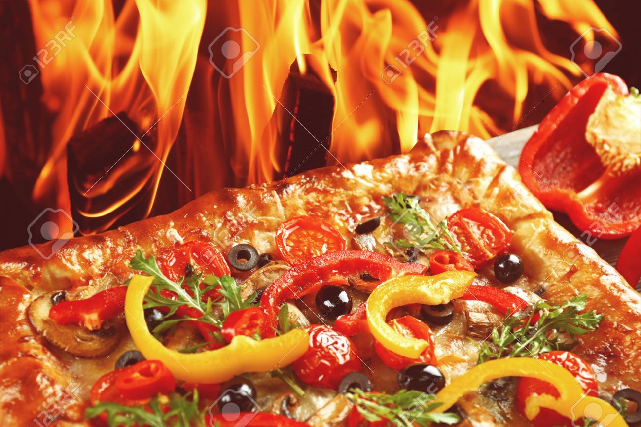 Freshly Homemade Pizza On Fire Flame Background Stock Photo Picture And Royalty Free Image Image 67270057