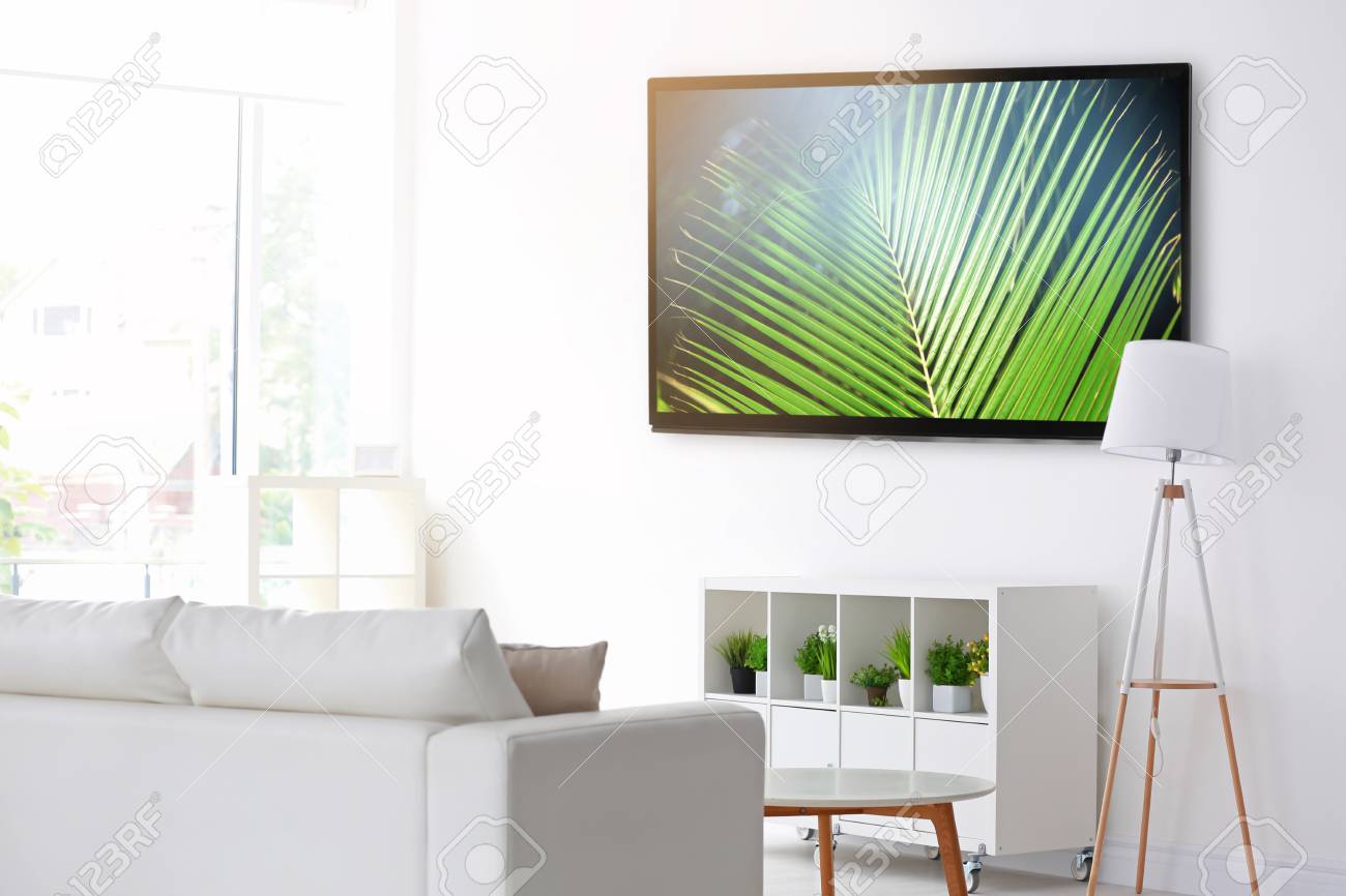 Cozy Interior Of Living Room With Tv On Wall Stock Photo Picture And Royalty Free Image Image 90868009