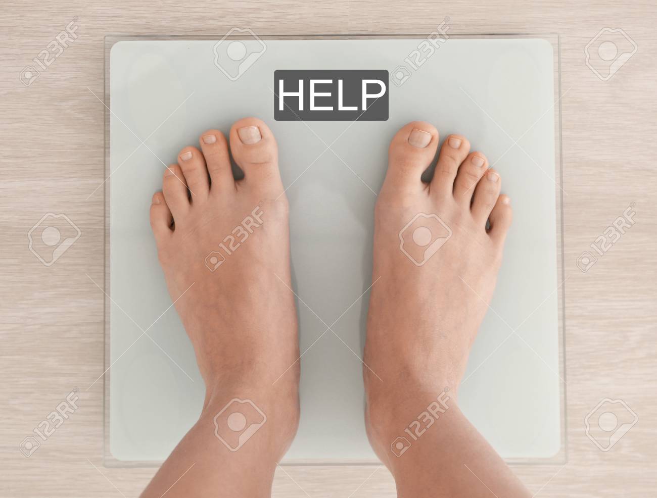 Weight Loss Concept. Woman Standing On Scales. Word HELP On Screen Stock  Photo, Picture and Royalty Free Image. Image 91840225.