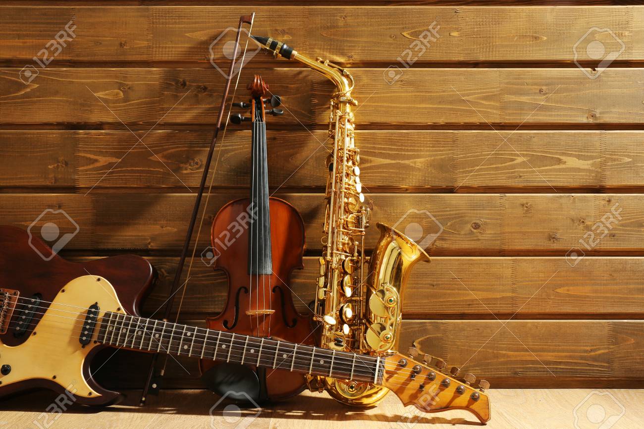 Musical instruments on wooden background - 94540927 Musical instruments on wooden background - 94540927