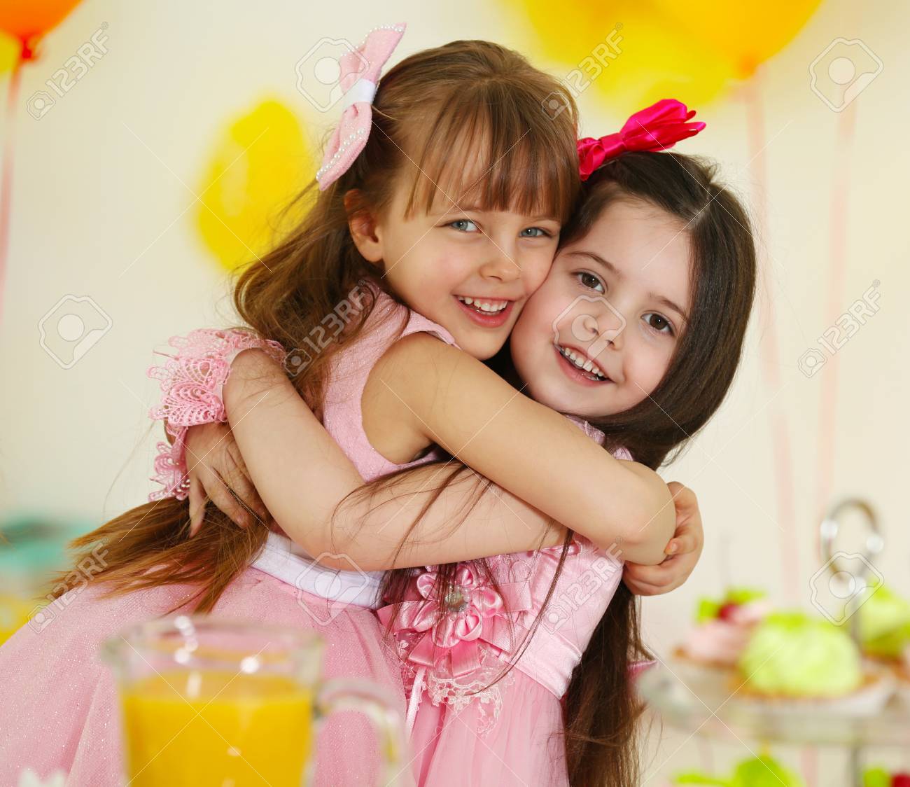 Happy Little Girls Hugging At Birthday Party Stock Photo, Picture And Royalty Free Image. Image 96074305.