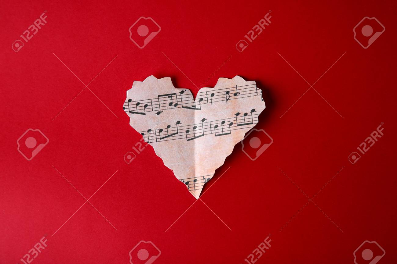 Paper Heart With Music Notes On Red Background