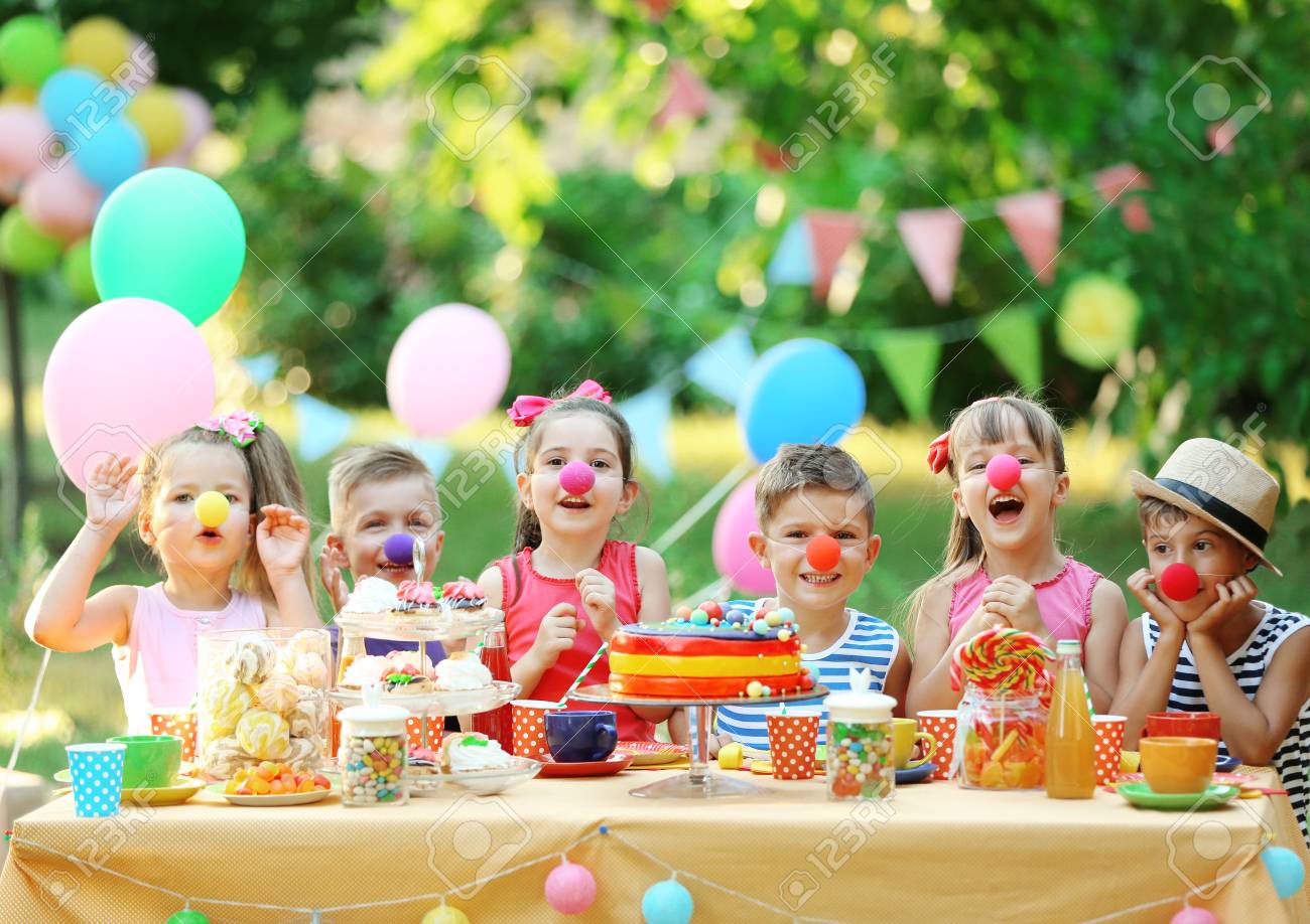 Children celebrating birthday in park - 96426727 Children celebrating birthday in park - 96426727