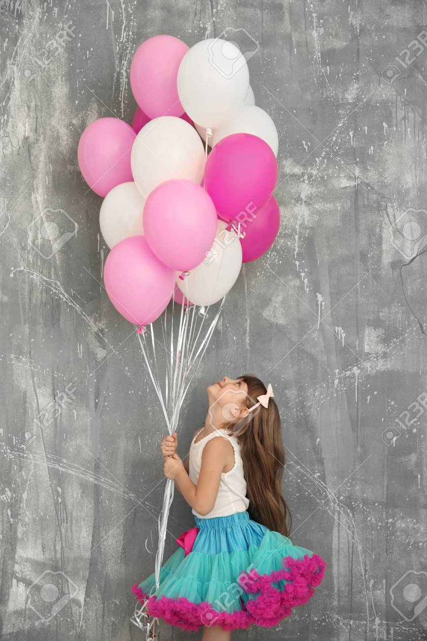 Colorful Balloons Near Grunge Wall 