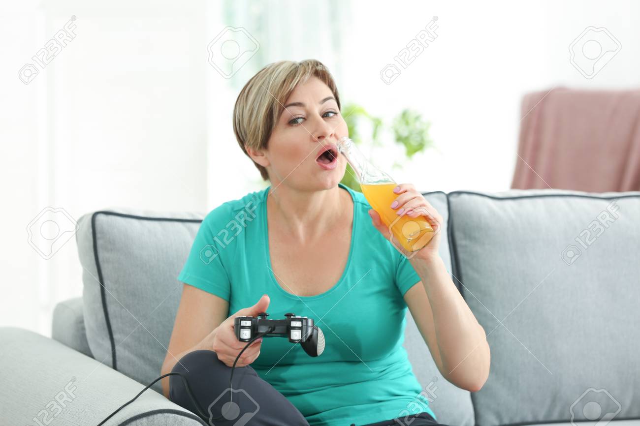 Mature Woman Playing Video Game And pic