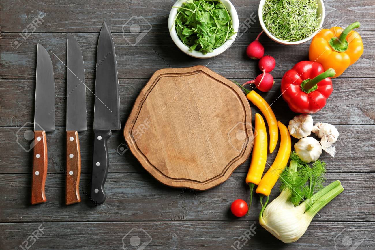 Wooden Board And Vegetables On Kitchen Table Cooking Classes Stock Photo