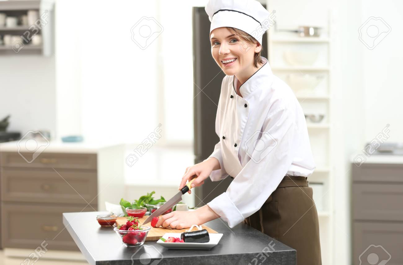 Female Chef Cooking In Kitchen Stock Photo Picture And Royalty Free Image Image 98299015