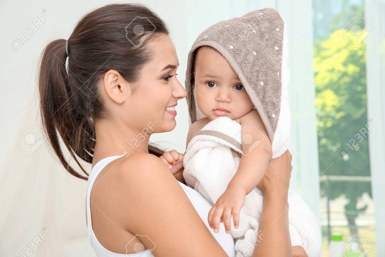 baby holding towel