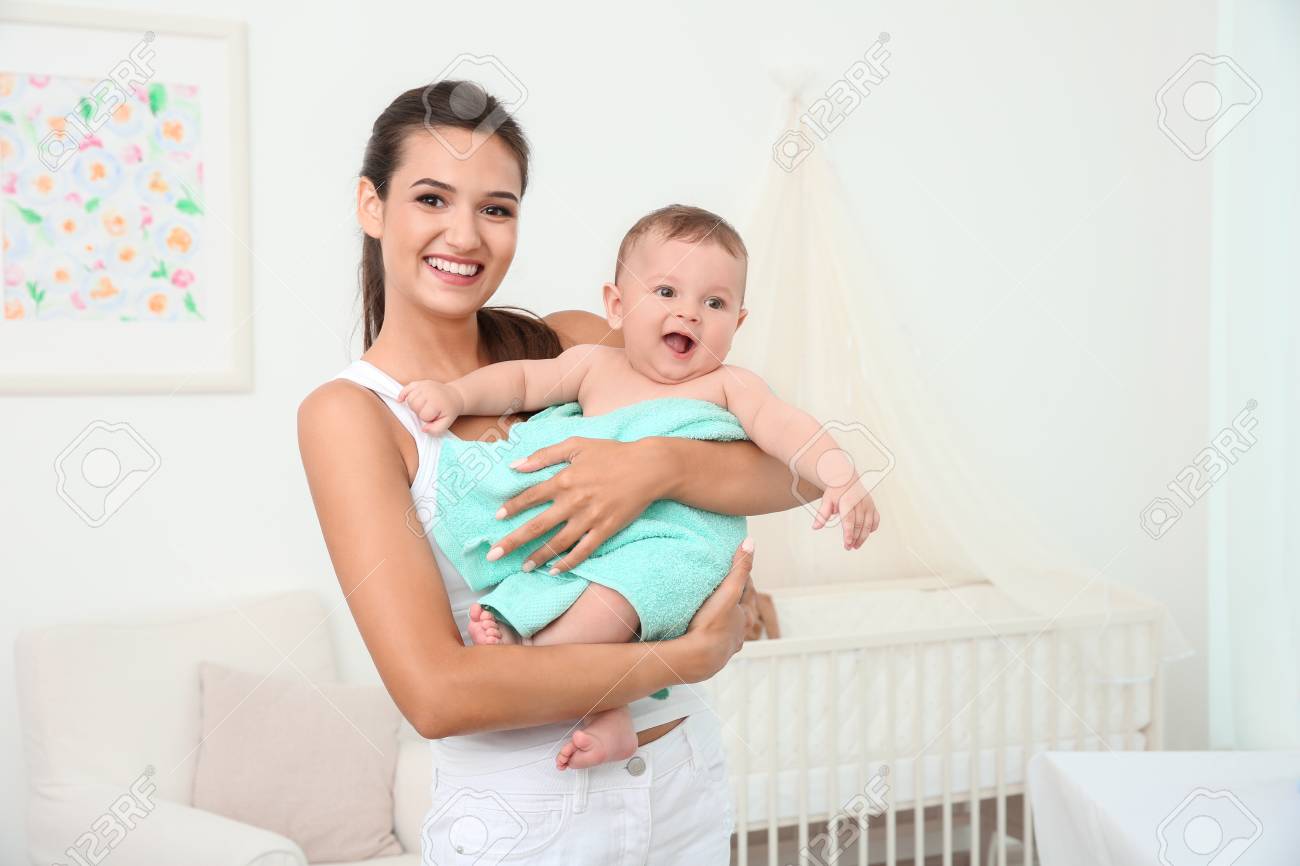 baby holding towel