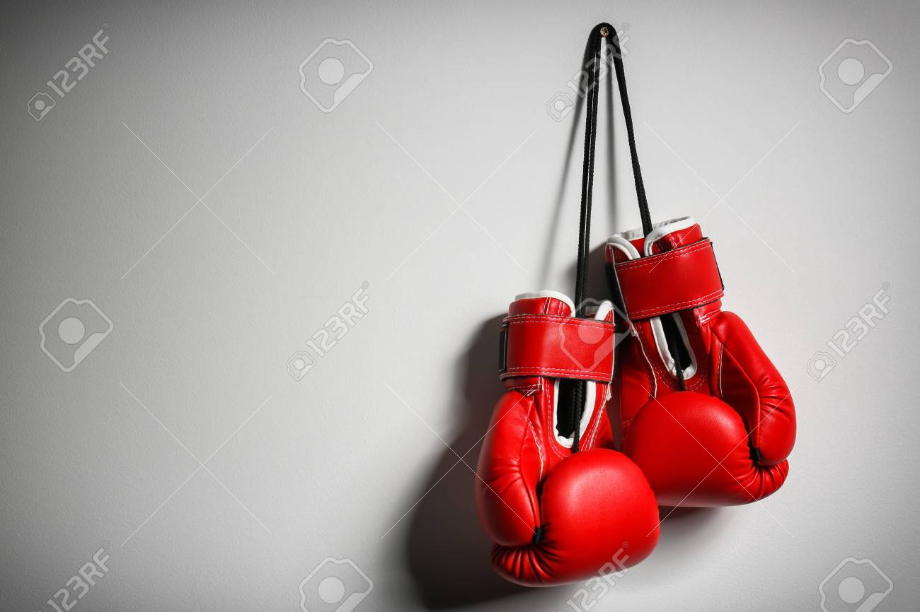 Boxing gloves on light background - 103177727 Boxing gloves on light background - 103177727