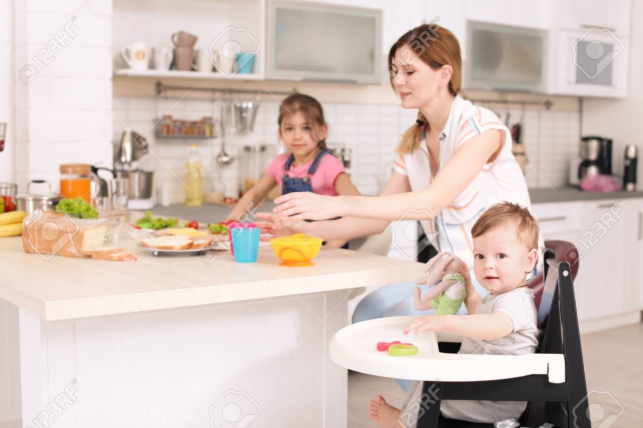 Children On Kitchen Stock Photo
