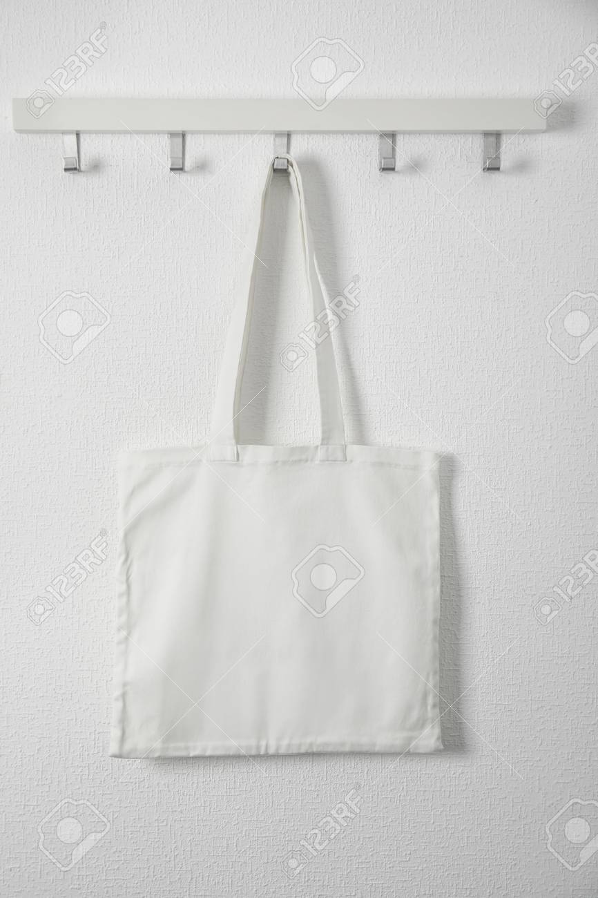 Download Tote Bag Hanging On White Wall Mock Up For Design Stock Photo Picture And Royalty Free Image Image 106681968 Yellowimages Mockups