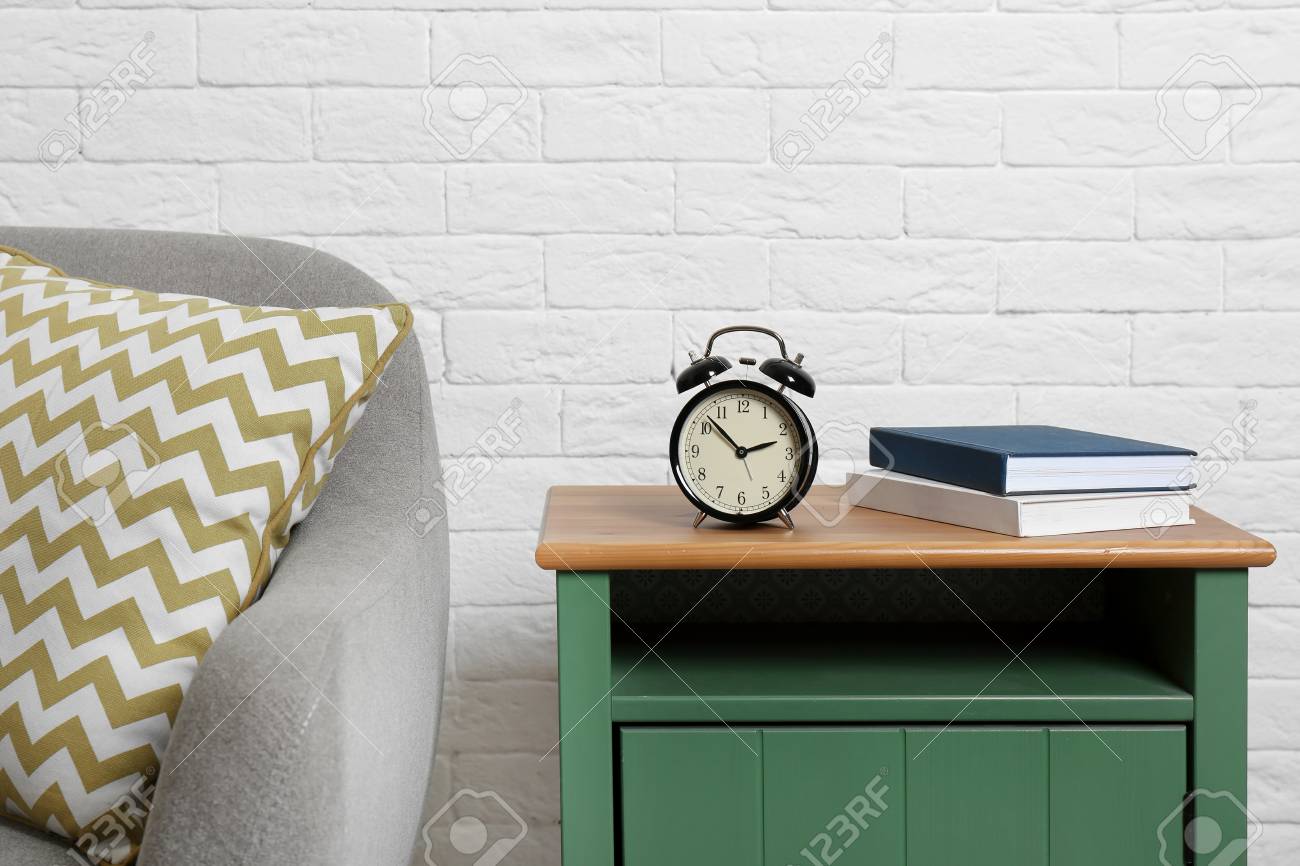 Analog Alarm Clock On Side Table In Living Room Time Of Day Stock Photo Picture And Royalty Free Image Image 110810122