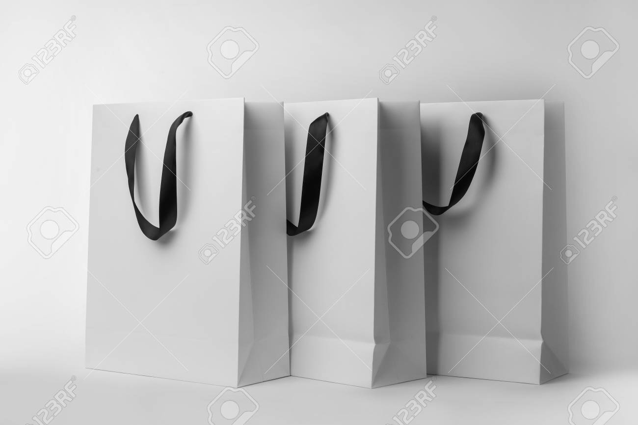 Download Paper Shopping Bags With Ribbon Handles On White Background Stock Photo Picture And Royalty Free Image Image 112634547