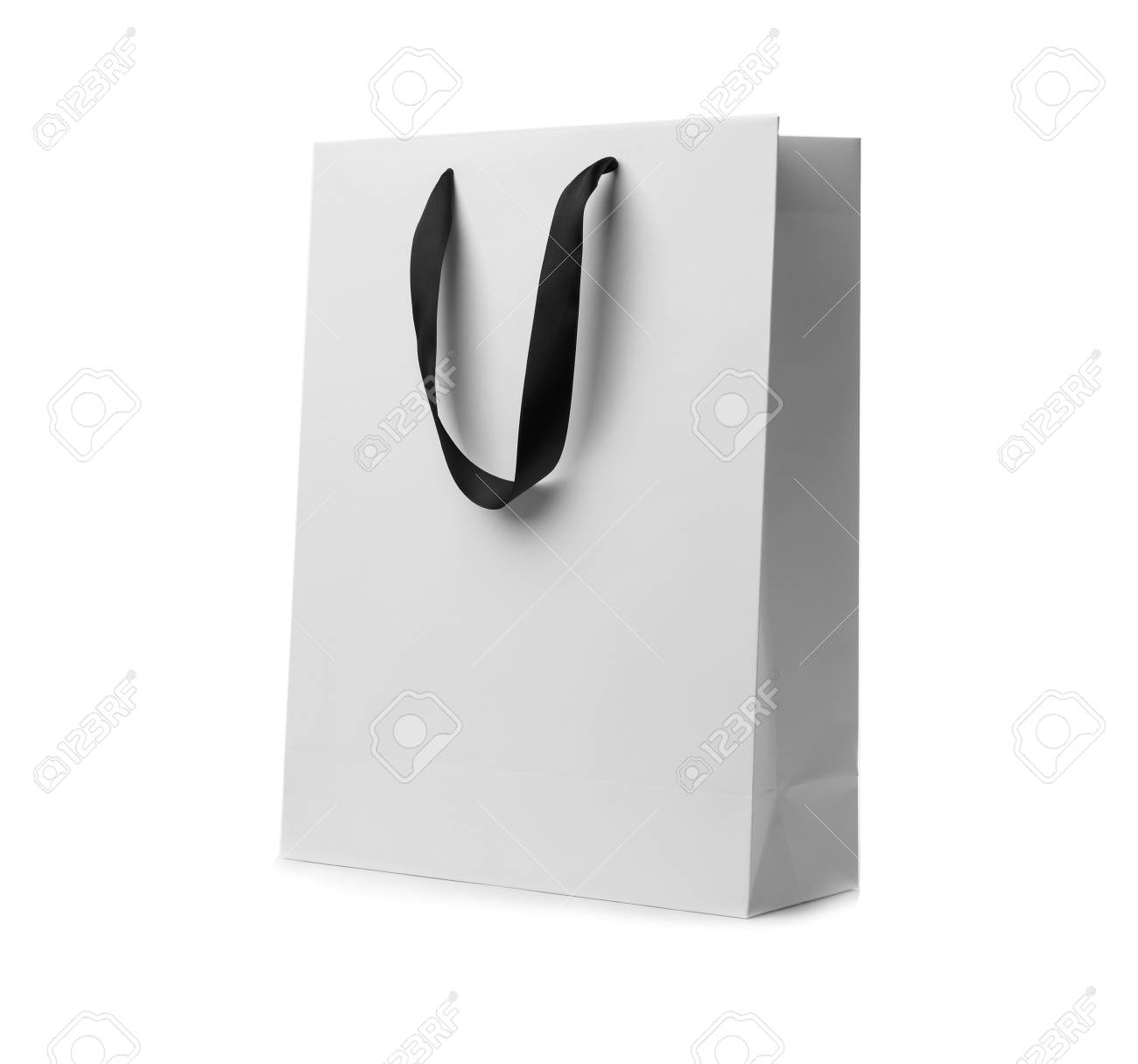 Download Paper Shopping Bag With Ribbon Handles On White Background Mockup Stock Photo Picture And Royalty Free Image Image 112750120