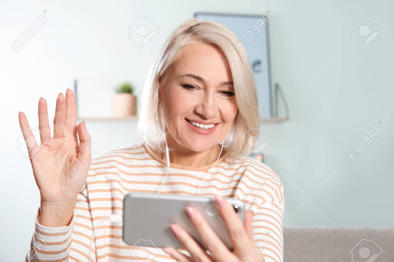 Mature Woman Using Video Chat On Mobile photo