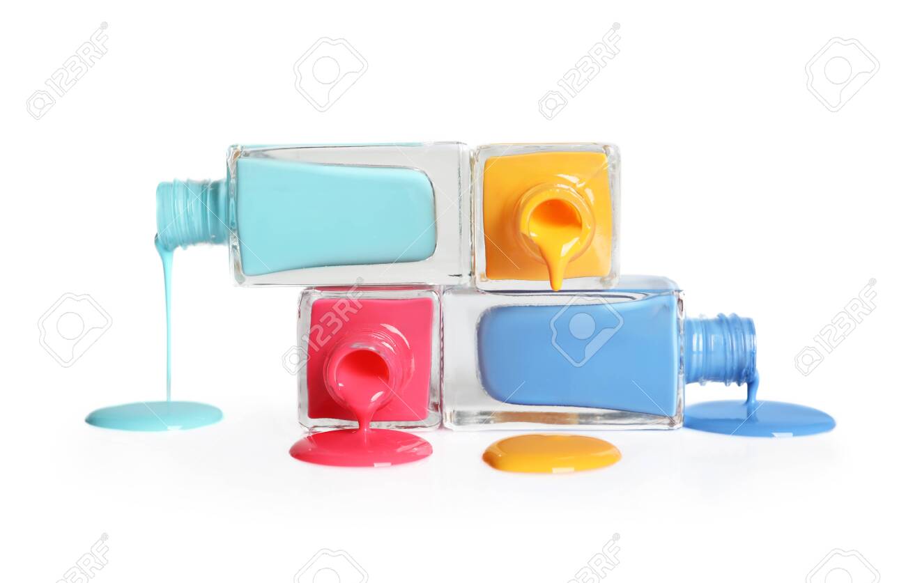 Spilled different nail polishes with bottles on white background - 122517630 Spilled different nail polishes with bottles on white background - 122517630