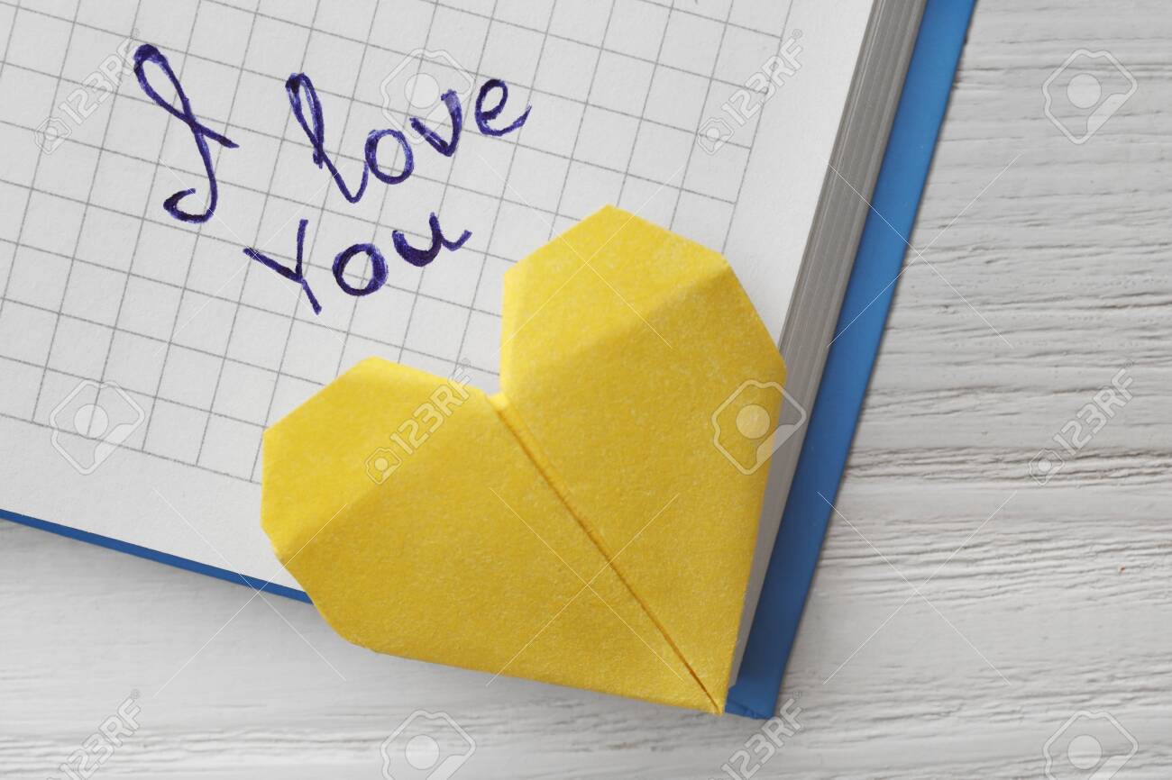 Notebook With Written Words I Love You And Origami Heart On White