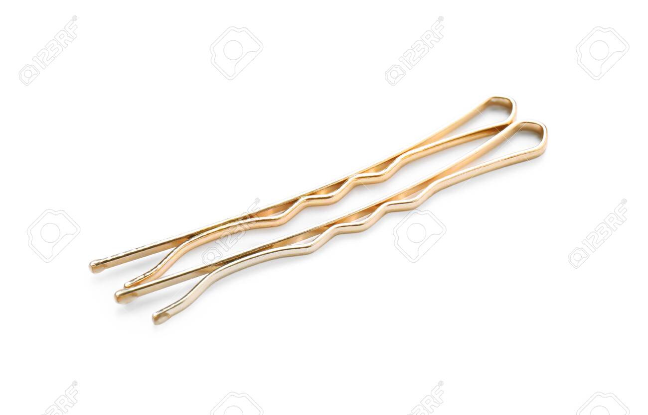Two Gold Hair Pins On White Background