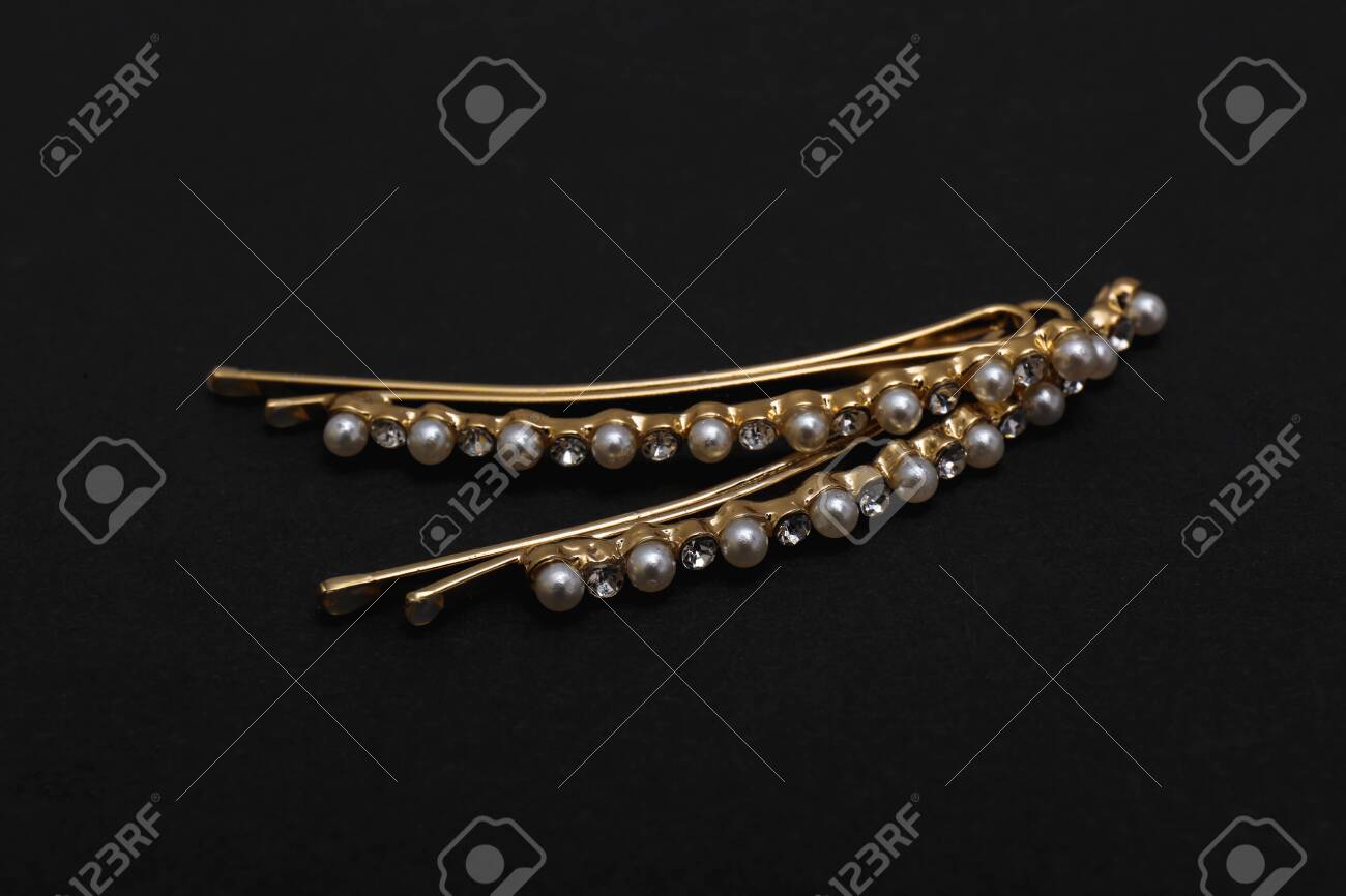 Beautiful Gold Hair Pins On Black Background