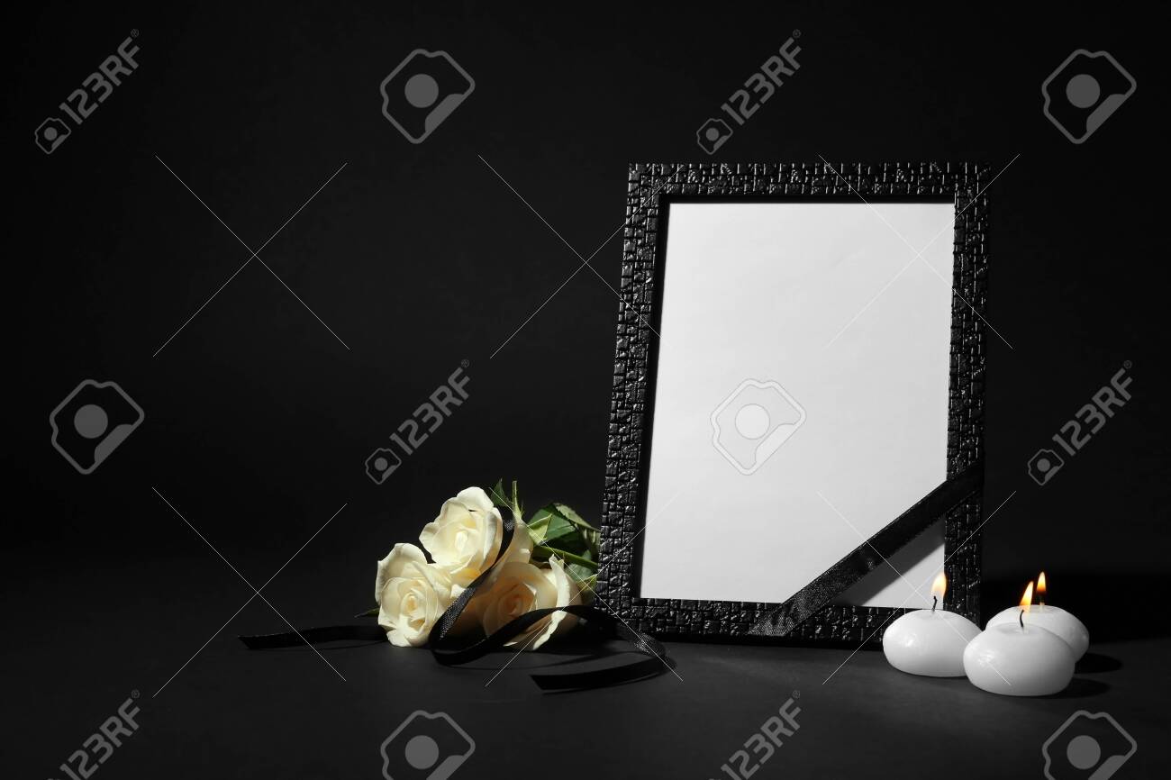 Funeral photo frame with ribbon, white roses and candles on black background. Space for design - 131671249 Funeral photo frame with ribbon, white roses and candles on black background. Space for design - 131671249