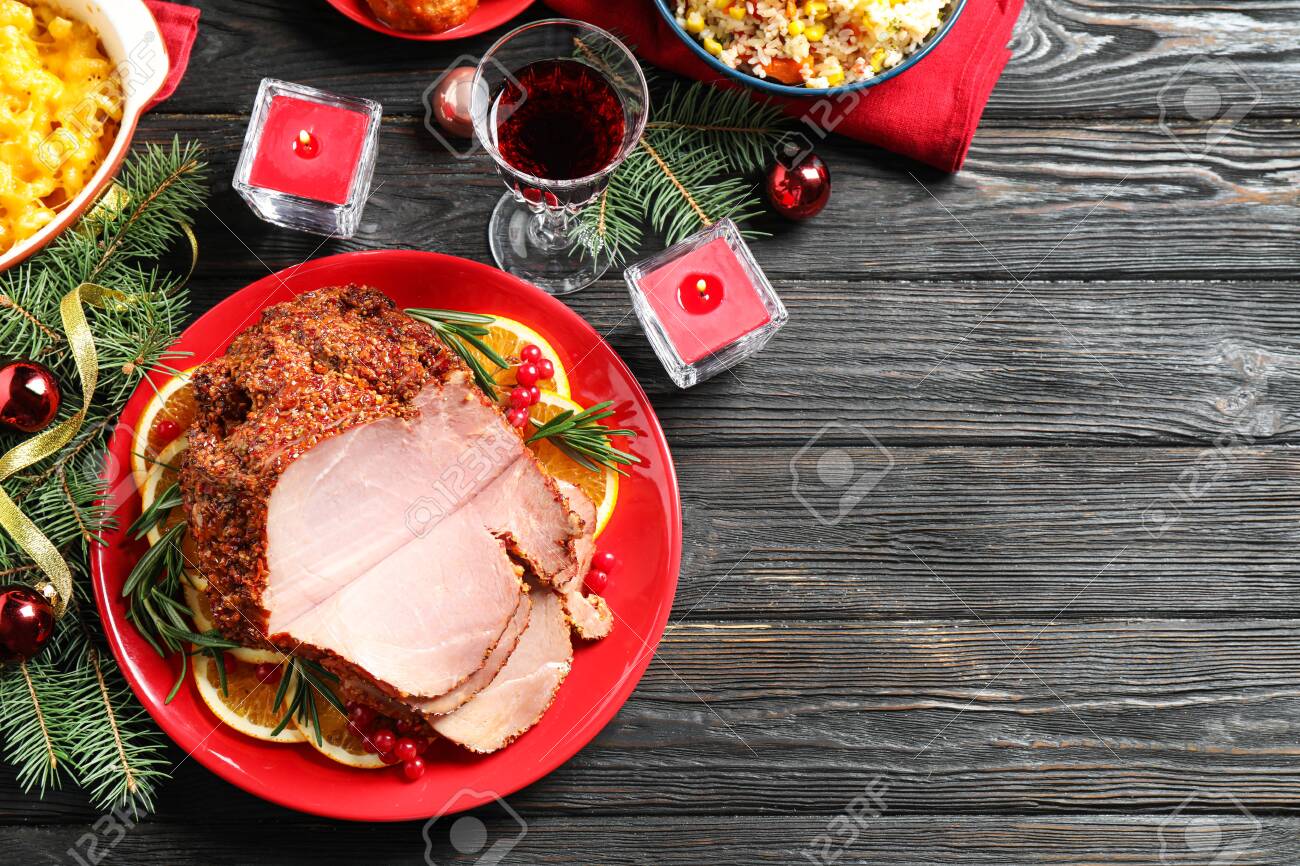 Flat lay composition with delicious ham served on dark wooden table, space for text. Christmas dinner - 132291005 Flat lay composition with delicious ham served on dark wooden table, space for text. Christmas dinner - 132291005