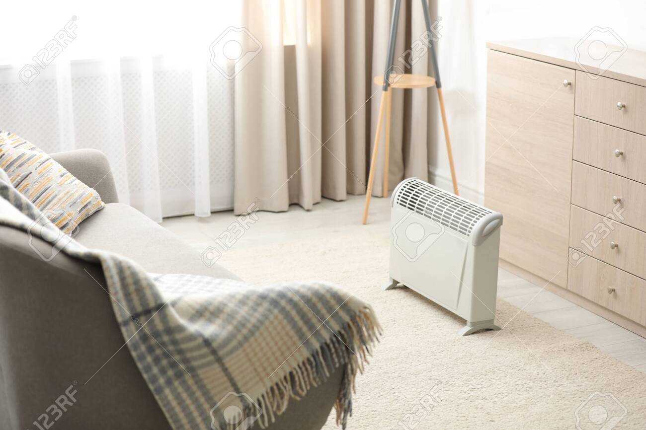 Modern electric heater in stylish room interior - 133321641 Modern electric heater in stylish room interior - 133321641