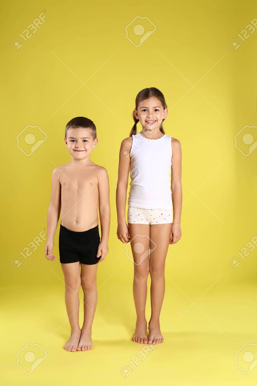 Cute little children in underwear on yellow background - 137170113 Cute little children in underwear on yellow background - 137170113