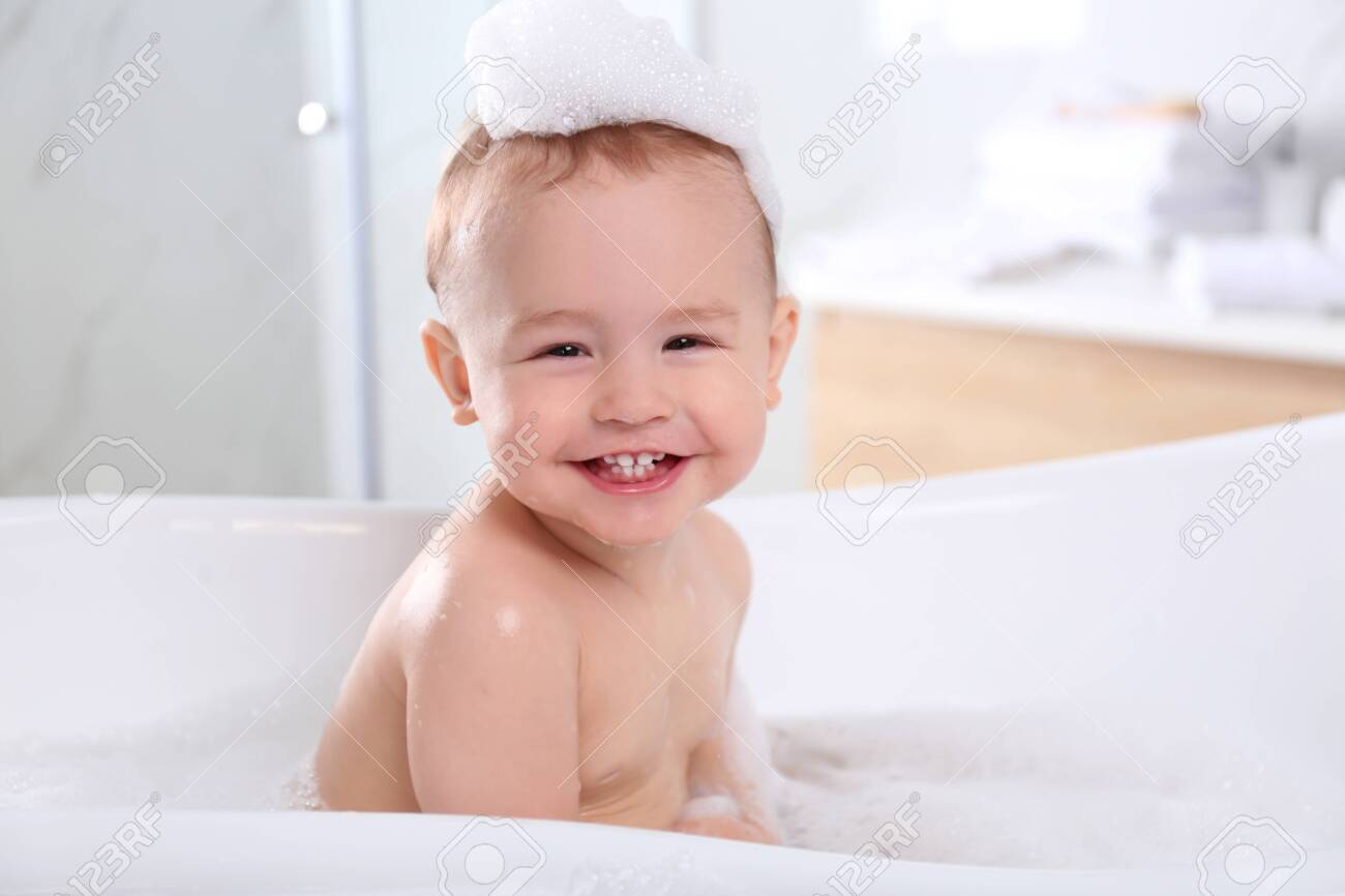 Cute little baby in bathtub at home - 137340031 Cute little baby in bathtub at home - 137340031