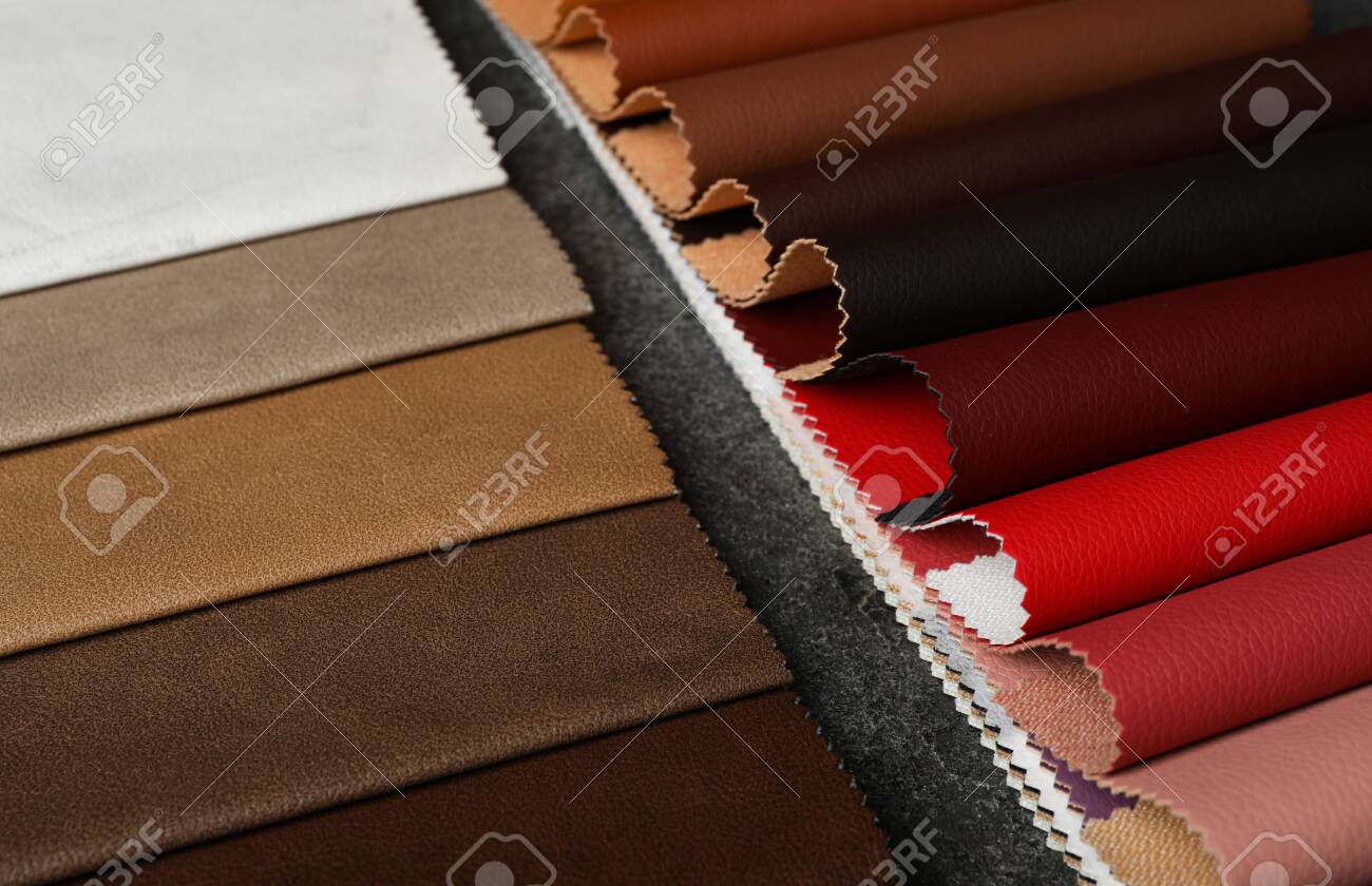 Leather samples on grey stone background, closeup - 141535205 Leather samples on grey stone background, closeup - 141535205