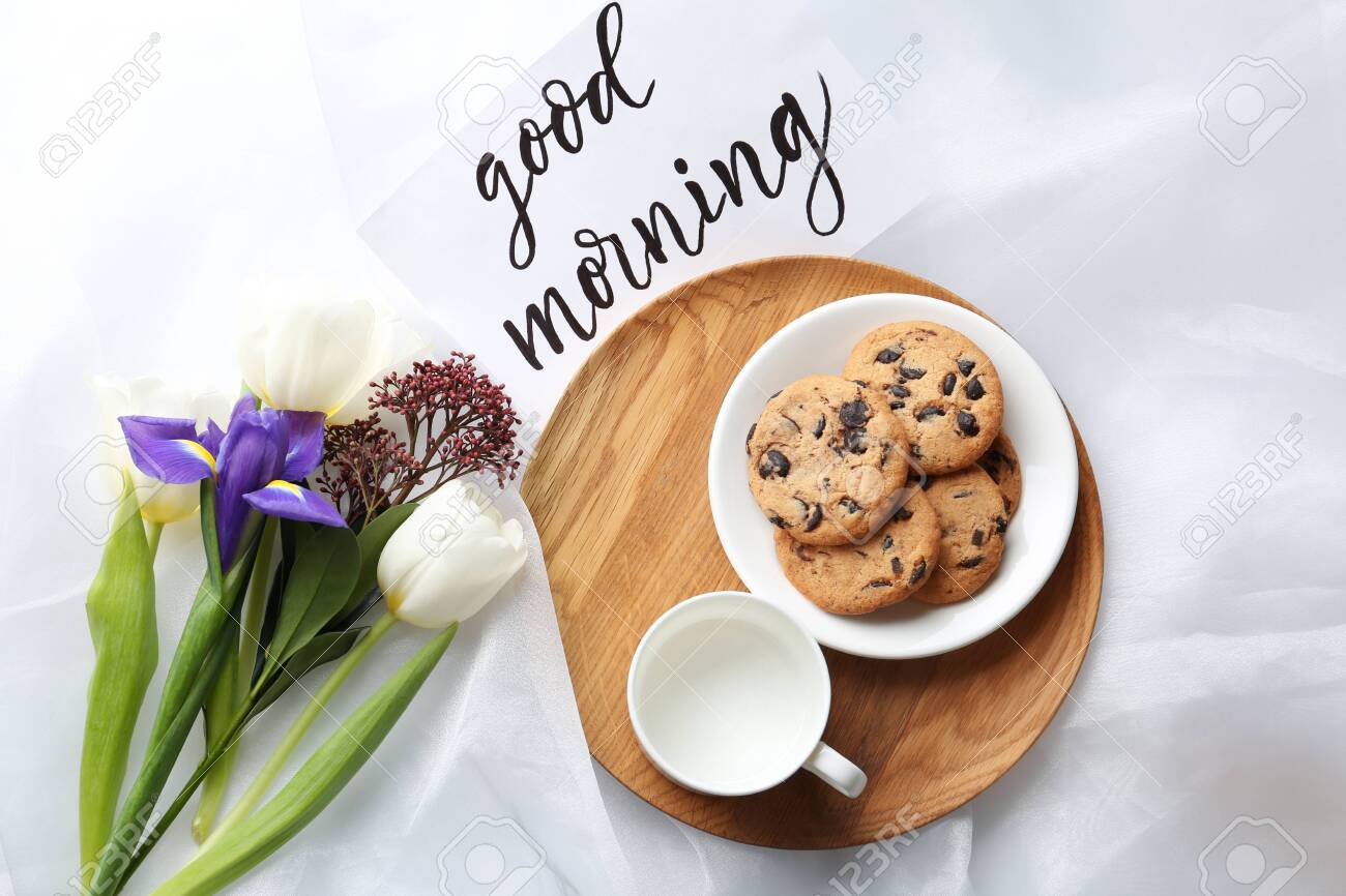 Delicious Cookies Flowers And Good Morning Wish On White Cloth Flat Lay Stock Photo Picture And Royalty Free Image Image 142043991