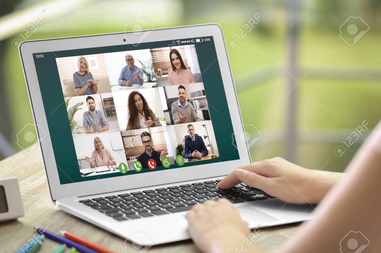 Woman having video chat with colleagues at table outdoors, closeup. Team work - 147401029 Woman having video chat with colleagues at table outdoors, closeup. Team work - 147401029