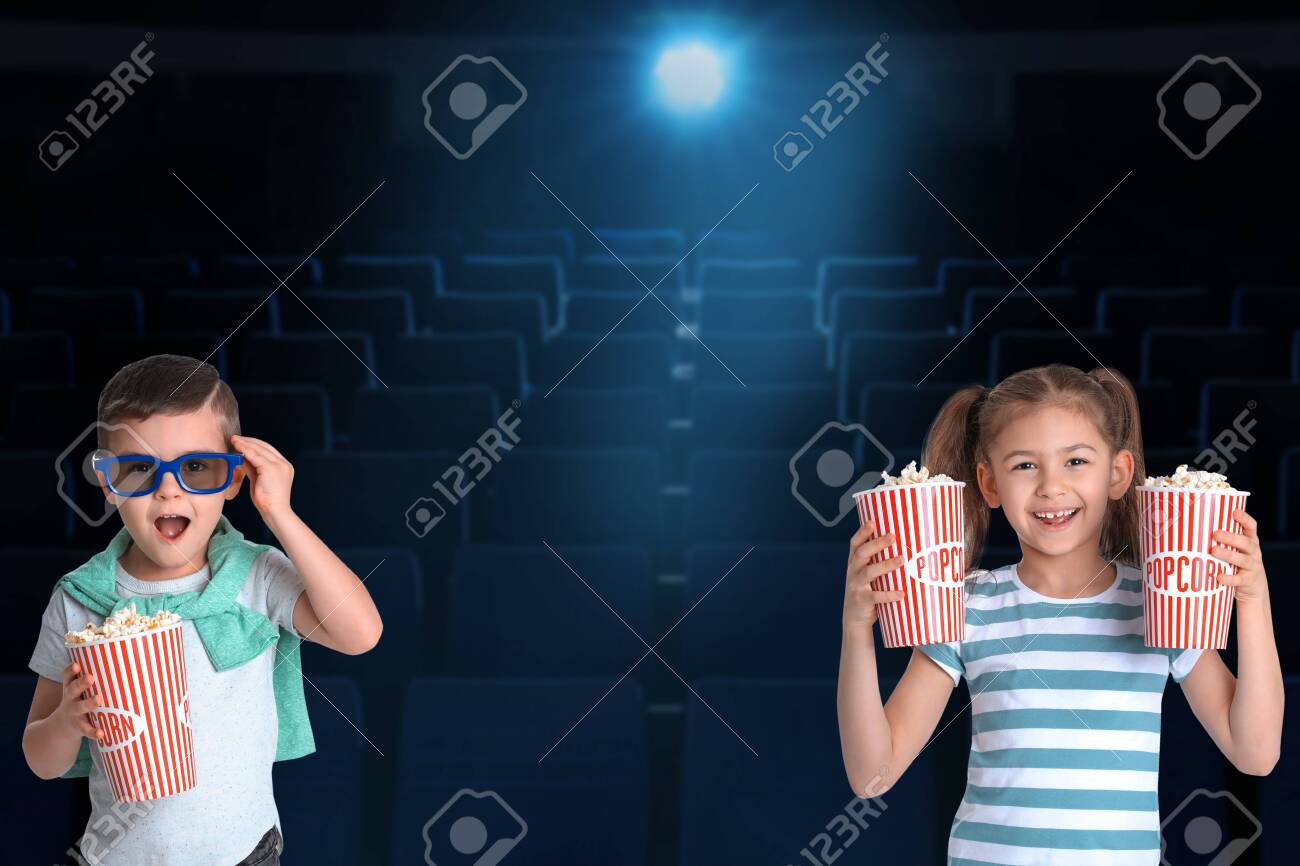 Cute Little Children With Popcorn In Cinema Hall Stock Photo Picture And Royalty Free Image Image
