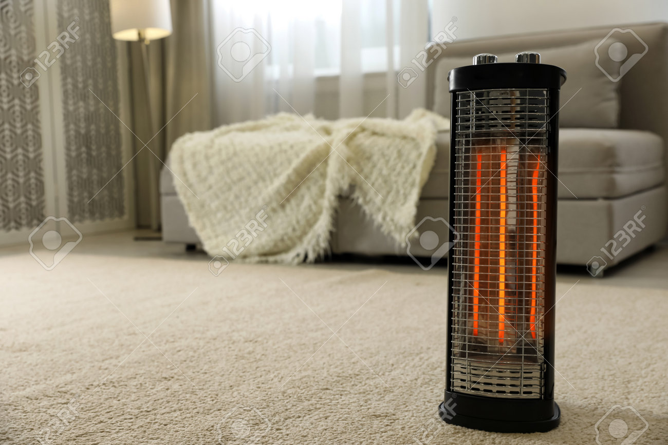 Modern electric halogen heater on floor in living room interior - 162214827 Modern electric halogen heater on floor in living room interior - 162214827