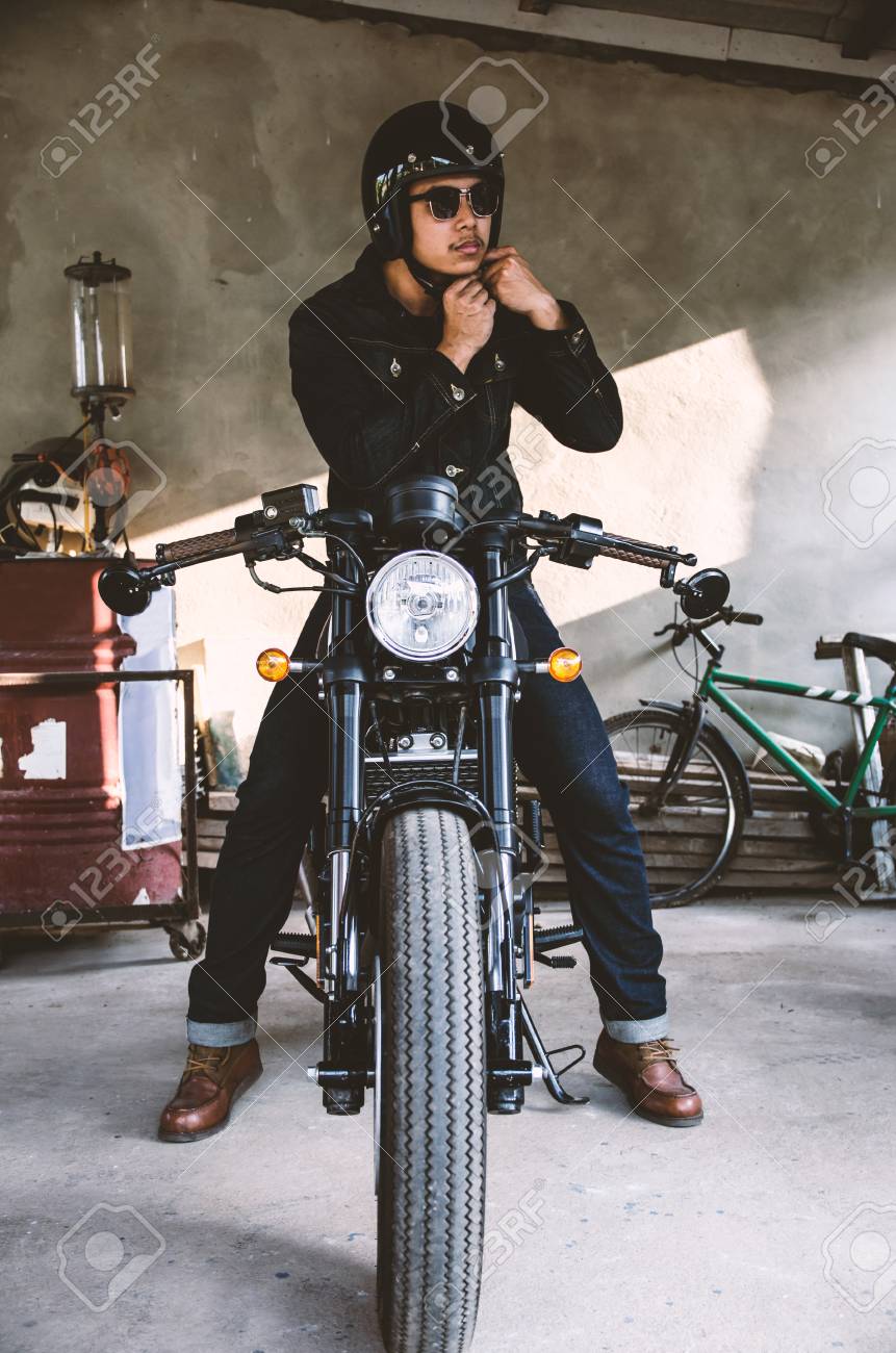 Young Man Is Wearing Helmet On Cafe Racer Motocycle Stock Photo Picture And Royalty Free Image Image 94690181