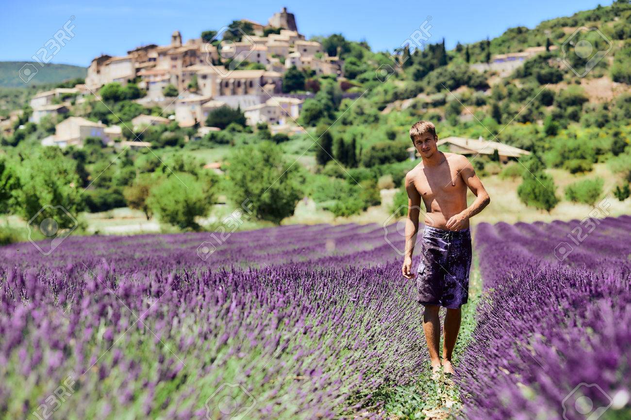 60342662-young-man-with-a-naked-torso-in-the-lavender-flowers-handsome-guy-enjoying-nature-and-the-beauty-of-.jpg