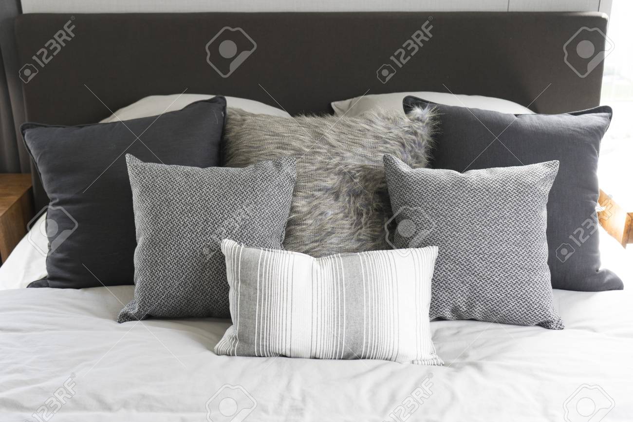 bed with loads of pillows