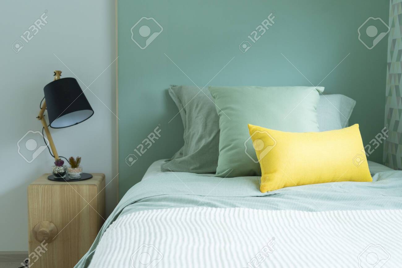 Contemporary Teen Bedroom With Green Pillow And Modern Side Table Stock Photo Picture And Royalty Free Image Image 130201720