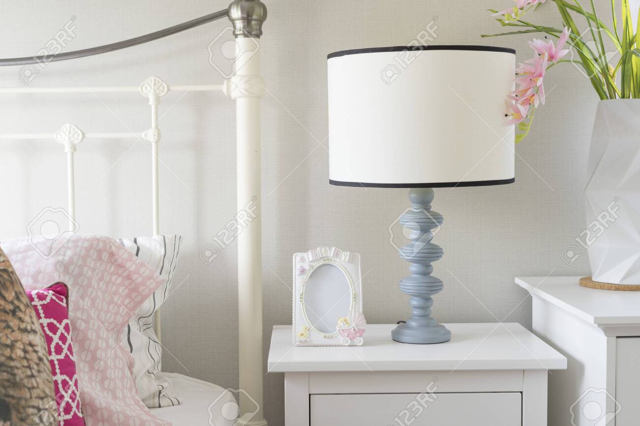 A Beautiful Bedroom In Pastel Pink Blue With A Bedside Table Stock Photo Picture And Royalty Free Image Image 152311779
