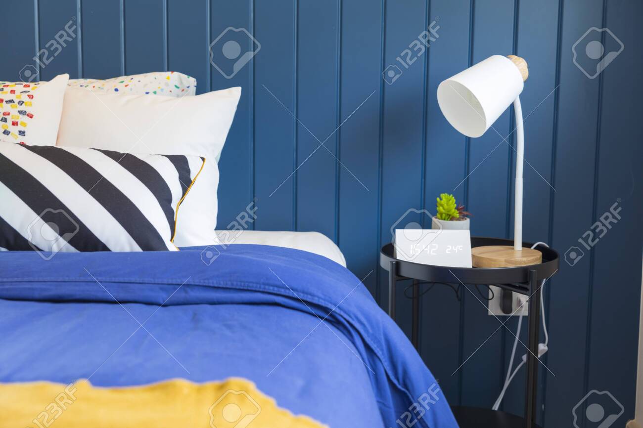 Yellow And Blue Graphic Print Pillow Setting With Table Lamp Stock Photo Picture And Royalty Free Image Image 154065725