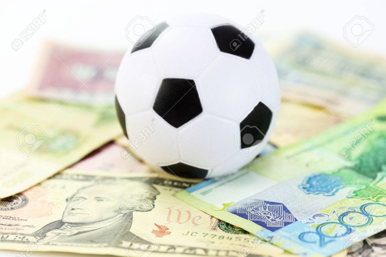 Football And Money Soccer Betting Concept Stock Photo, Picture And Royalty Free Image. Image 28831137.