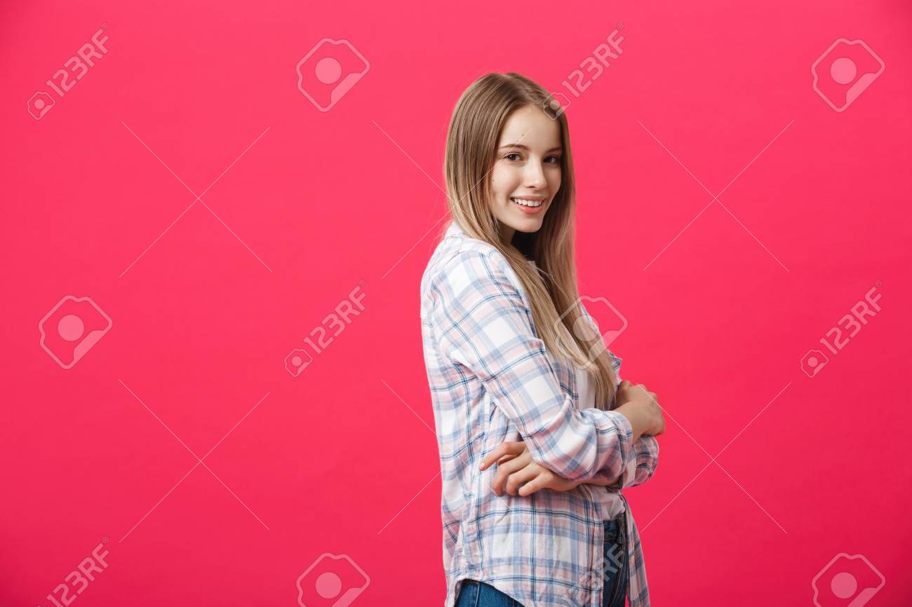 Smiling beautiful woman portrait with crossed arms on pink background - 112996414 Smiling beautiful woman portrait with crossed arms on pink background - 112996414