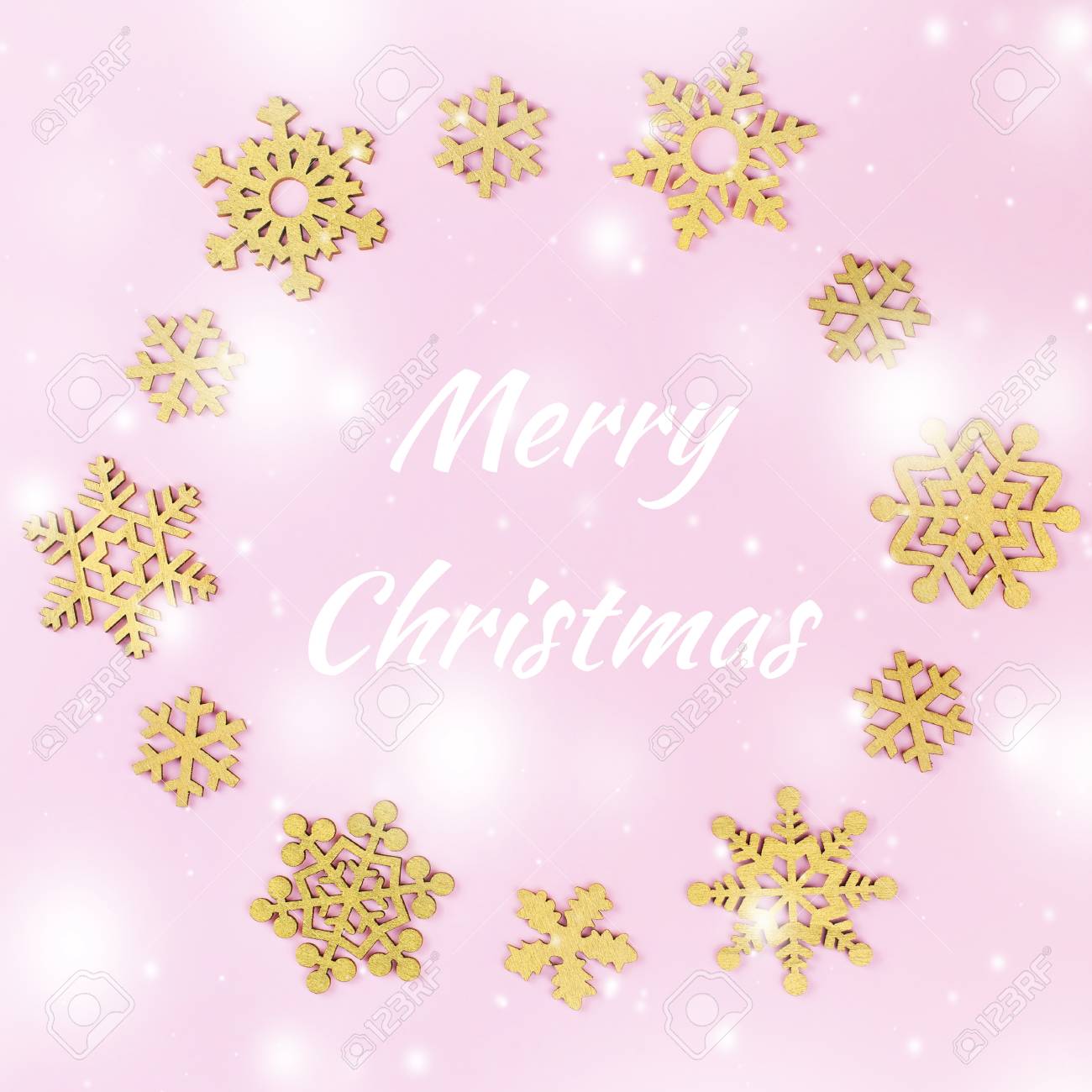 merry christmas card with golden snowflakes in pastel pink color pink christmas card
