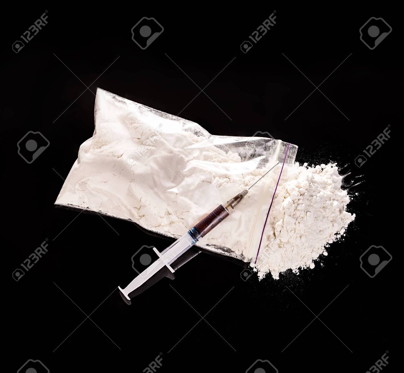Drug powder, drug syringe close-up on a black background. - 126197441 Drug powder, drug syringe close-up on a black background. - 126197441