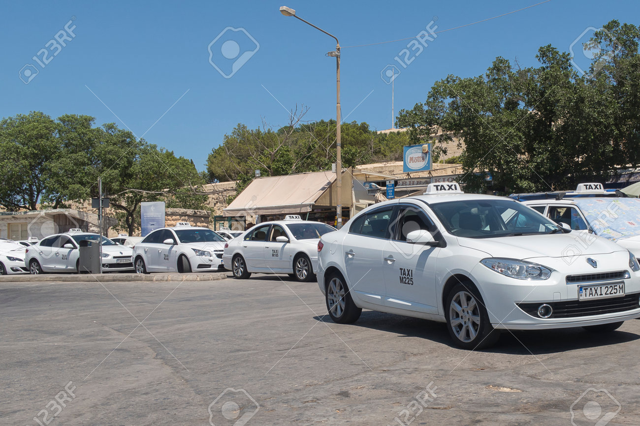 https://previews.123rf.com/images/bestravelvideo/bestravelvideo1608/bestravelvideo160800020/61738443-valletta-malta-02-august-2016-taxis-at-a-stand-before-valletta-city-gate-white-taxis-can-pick-up.jpg